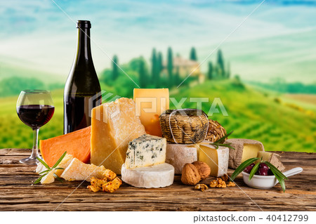 Various kind of cheese served on wood Various kind of cheese served on wood 40412799