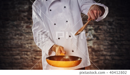 Closeup of chef holding empty grill pan 40412802
