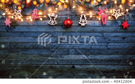 Christmas background with wooden decorations and spot lights. Christmas background with wooden decorations and spot lights. 40412804