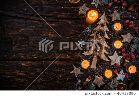 Christmas background with wooden decorations and candles. Free space for text. Christmas background with wooden decorations and candles. Free space for text. 40412890