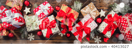 Christmas gift boxes placed on wooden planks 40413027
