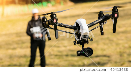 Man handling drone in nature 40413488