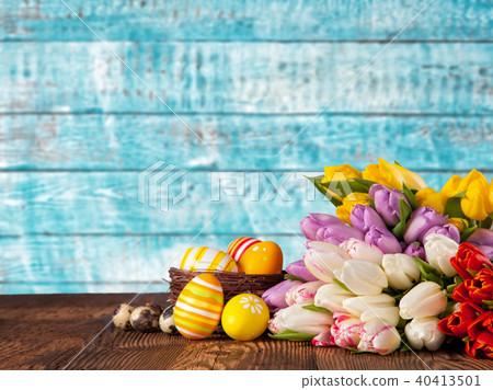 Bouquet of colored tulips with Easter eggs Bouquet of colored tulips with Easter eggs 40413501