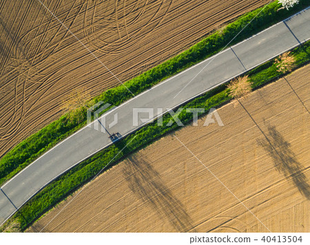 Motorcyclist on road shot from air Motorcyclist on road shot from air 40413504