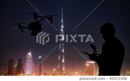 Man handling drone with modern city on background Man handling drone with modern city on background 40413506