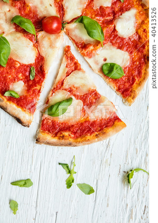 Delicious italian pizza served on wooden table 40413526