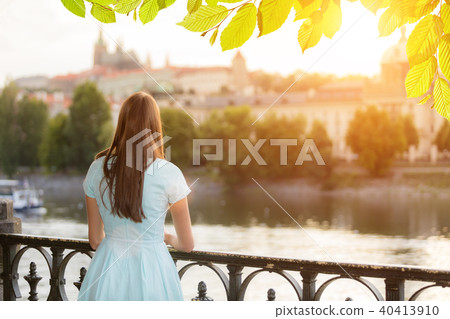 Brunette girl watching old town center Brunette girl watching old town center 40413910