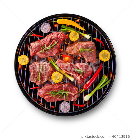 Fresh raw beef steaks placed on grill, isolated on white background 40413916