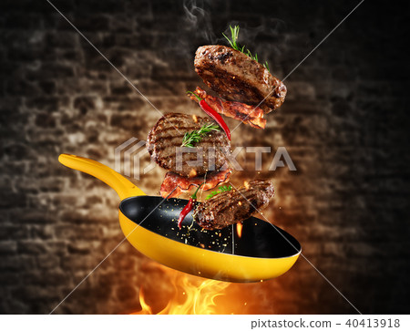 Beef milled meat flying from a pan Beef milled meat flying from a pan 40413918