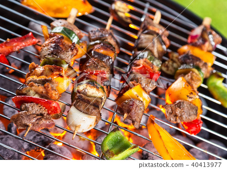 Grill with meat skewers 40413977