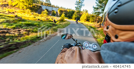 Two motorbikers riding on empty road Two motorbikers riding on empty road 40414745