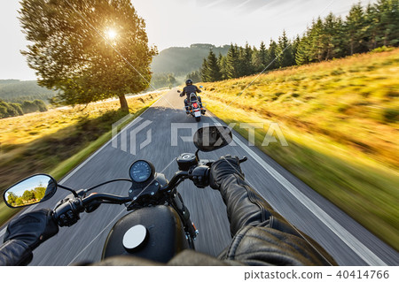 Motorcycle drivers riding on motorway 40414766