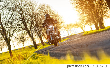 Young man driving chopper 40414781