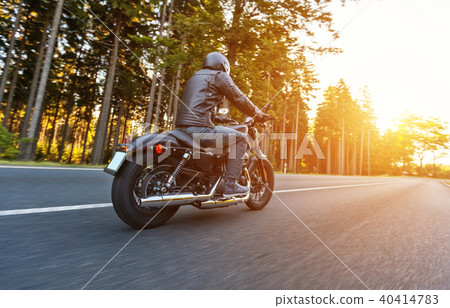 Back view of motorcycle driver on road Back view of motorcycle driver on road 40414783