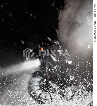 High power motorcycle chopper with man rider at night 40414798
