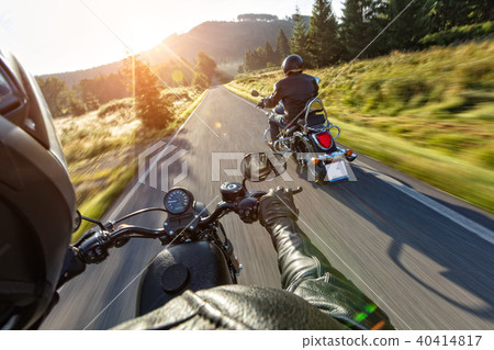Motorcycle drivers riding on motorway 40414817