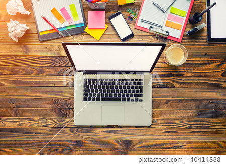 Laptop with other modern electonic devices on desk Laptop with other modern electonic devices on desk 40414888