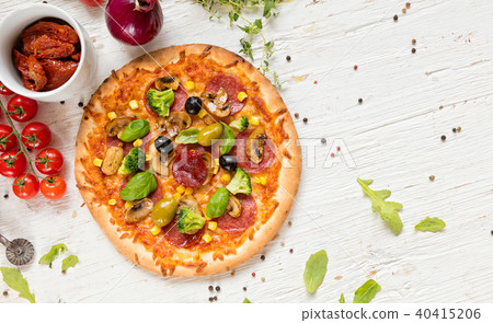 Delicious pizza served on wooden table 40415206