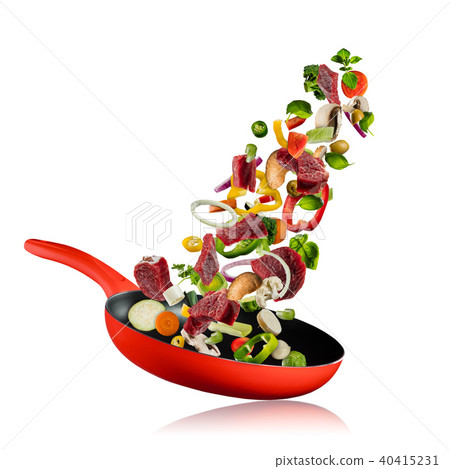 Fresh vegetables and beef meat flying into a pan on white background Fresh vegetables and beef meat flying into a pan on white background 40415231