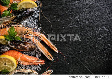 Seafood served on black stone Seafood served on black stone 40415485