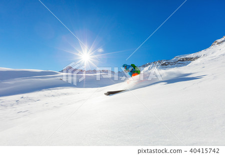 Freerider skier running downhill Freerider skier running downhill 40415742