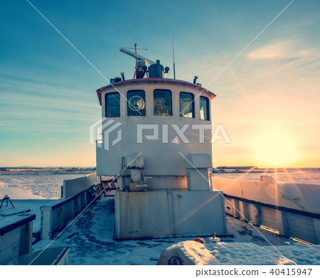 Old fisherman boat in Iceland in grunge colored design Old fisherman boat in Iceland in grunge colored design 40415947