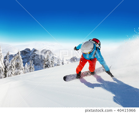 Snowboarder running downhill Snowboarder running downhill 40415966