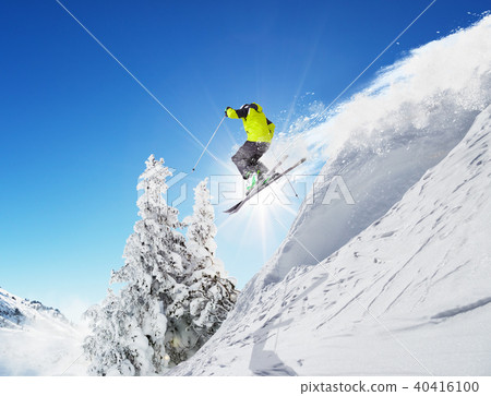 Skier at jump in Alpine mountains Skier at jump in Alpine mountains 40416100