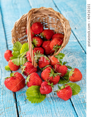 Strawberry in basket placed on old wooden planks Strawberry in basket placed on old wooden planks 40416101