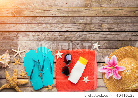 Beach accessories on wooden background Beach accessories on wooden background 40416123