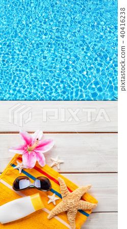 Beach accessories on wooden background with pool Beach accessories on wooden background with pool 40416238