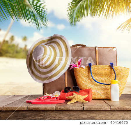 Suitcase and accessories for travelling on wood 40416470