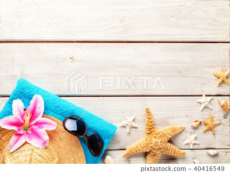 Beach accessories on wooden background Beach accessories on wooden background 40416549