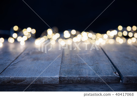 Blurred abstract golden spot lights with wood Blurred abstract golden spot lights with wood 40417068