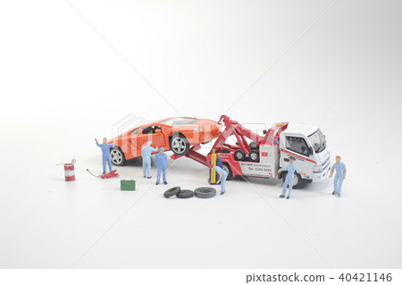 the mini truck worker near broken down car 40421146