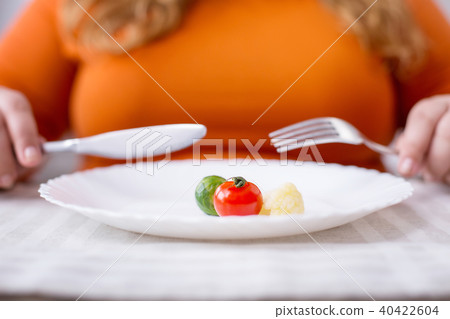 Stout woman being on a healthy diet Stout woman being on a healthy diet 40422604