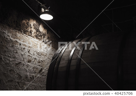 Old wooden barrel under electric lamp 40425706