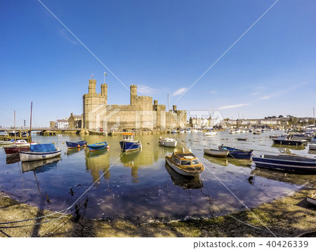 The skyline of Caernafon in Wales during low tide - United Kingdom The skyline of Caernafon in Wales during low tide - United Kingdom 40426339