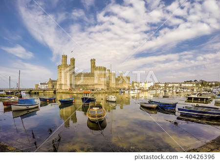 The skyline of Caernafon in Wales during high tide - United Kingdom The skyline of Caernafon in Wales during high tide - United Kingdom 40426396