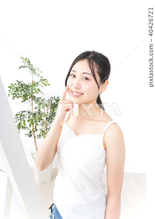 A young woman doing skin care A young woman doing skin care 40426721