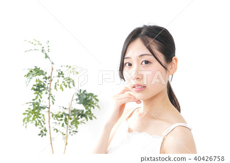 A young woman doing skin care A young woman doing skin care 40426758