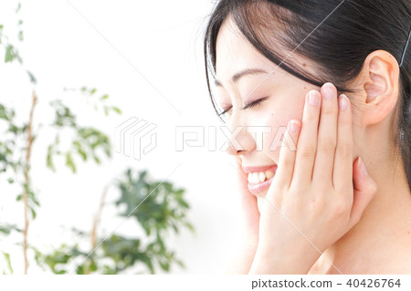 A young woman doing skin care A young woman doing skin care 40426764