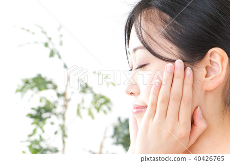 A young woman doing skin care A young woman doing skin care 40426765