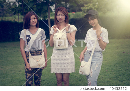 portrait of three asia young girl with bag on park portrait of three asia young girl with bag on park 40432232