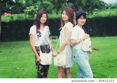 portrait of three asia young girl with bag on park 40432233