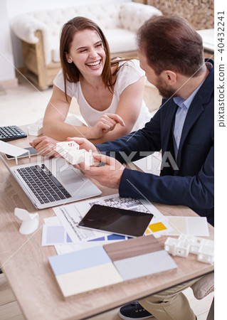 Jovial two designers joking during work Jovial two designers joking during work 40432241