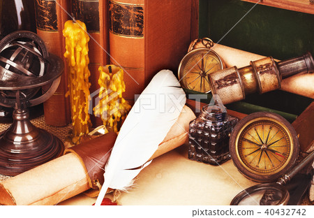 Old books, feather pen and ink bottle, old scroll  40432742