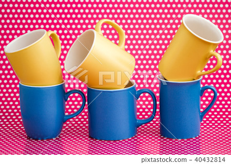 Colorful Coffee Mugs on Pink Background 40432814