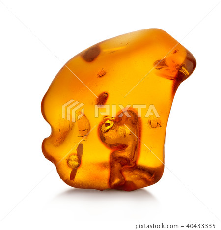 Piece of amber isolated on white background Piece of amber isolated on white background 40433335