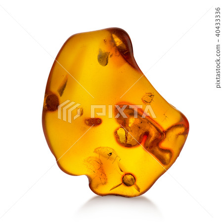 Piece of amber isolated on white background 40433336